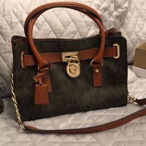 MK bag with shoulder & arm straps w/large gold lock and gold chain. Excellent